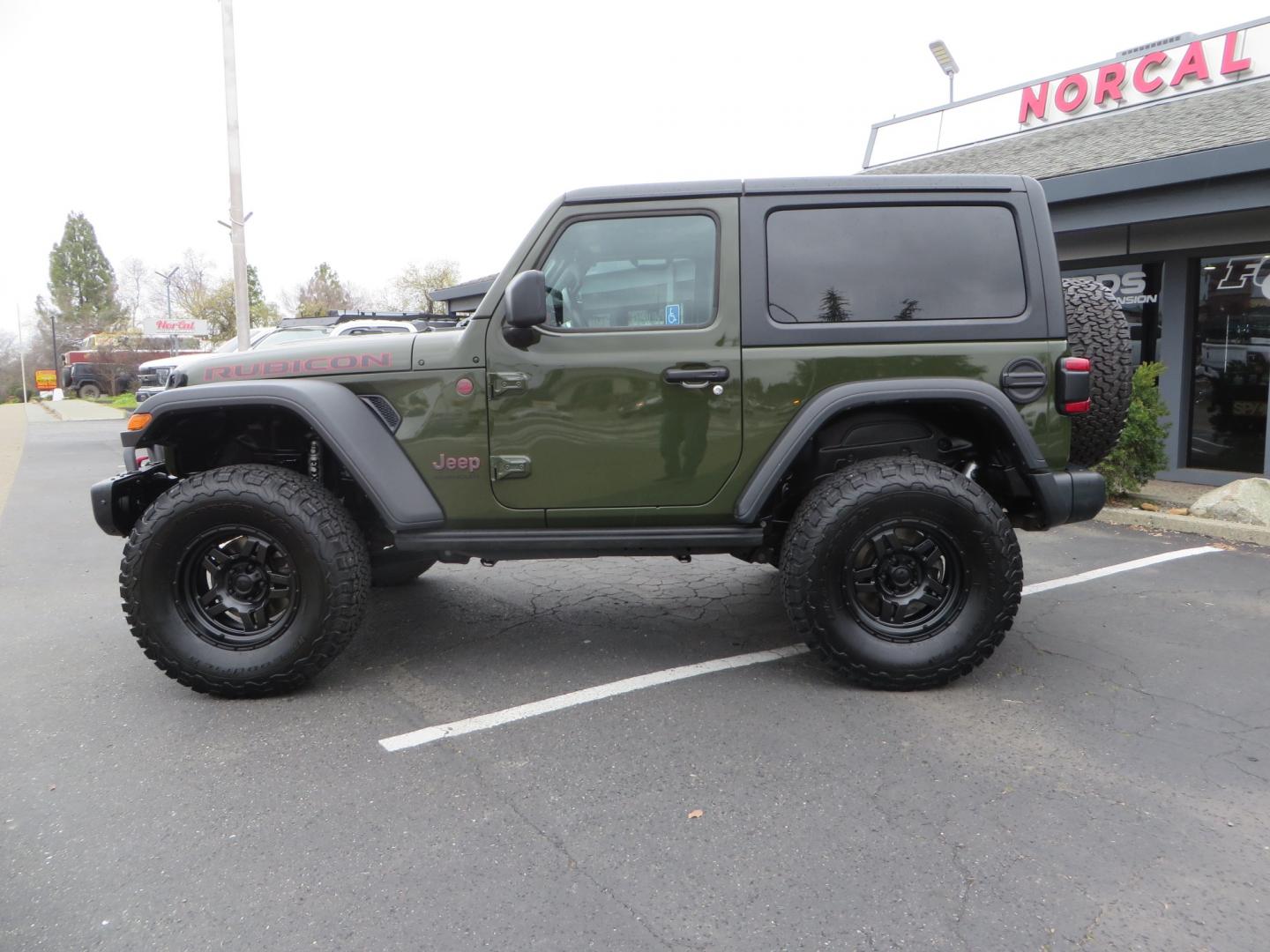 2021 Sarge Green /BLACK Jeep Wrangler Rubicon (1C4HJXCN4MW) with an 2.0L L4 DOHC 16V TURBO engine, 6A transmission, located at 2630 Grass Valley Highway, Auburn, CA, 95603, (530) 508-5100, 38.937893, -121.095482 - Rubicon featuring a Mopar suspension system, Fox shocks, 17" Fuel Wheels, BFG KO2 tires, Maxximus 3 front bumper stinger, Dual exhaust, Bolt hitch lock, Mopar HD tailgate hinge, and a custom cargo platform. - Photo#7